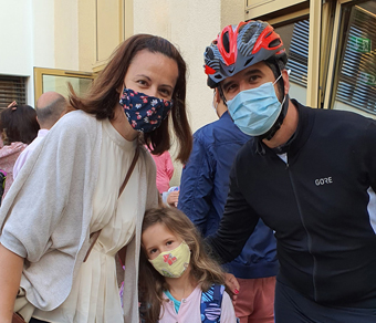 The Milos family with their masks
